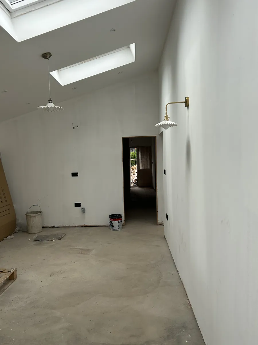 Vaulted extension interior with wall lighting