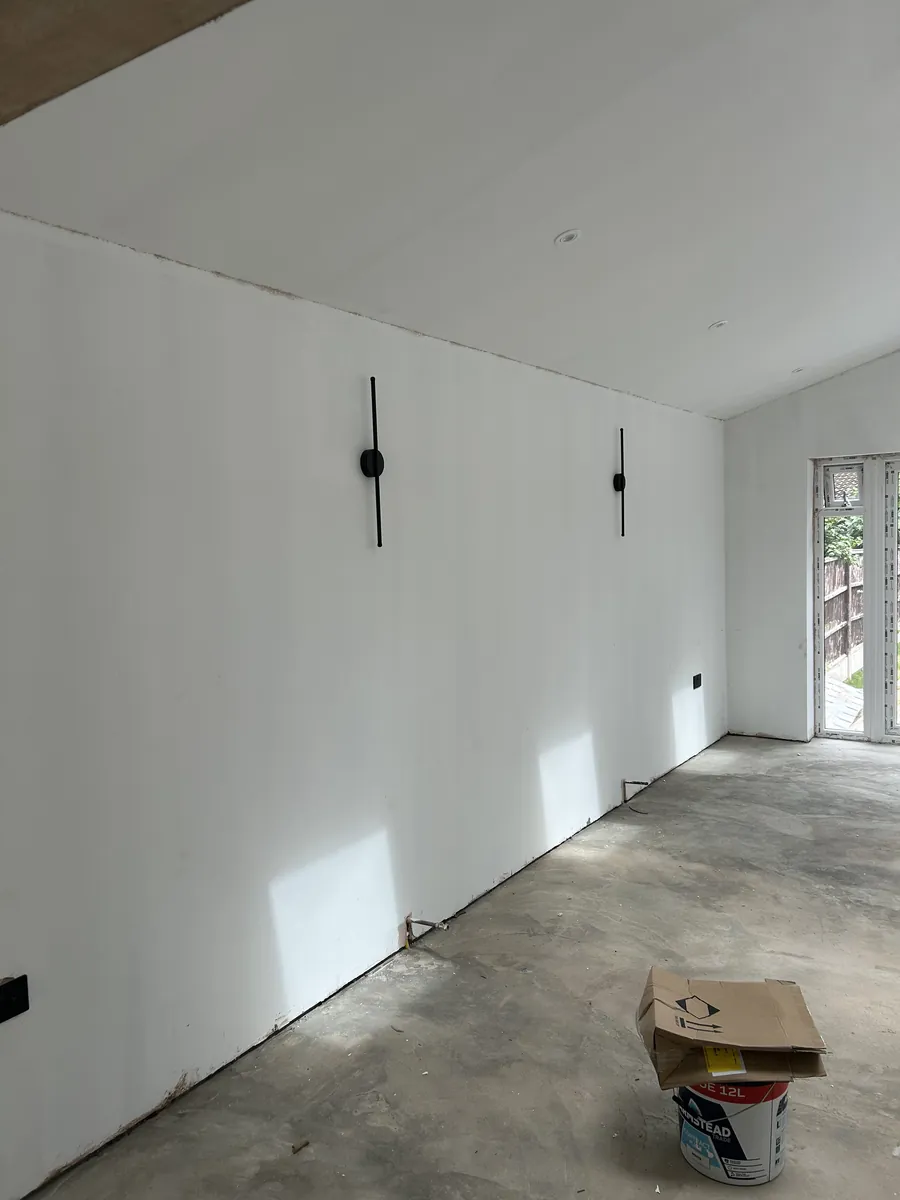 Extension interior with wall lights during fit-out