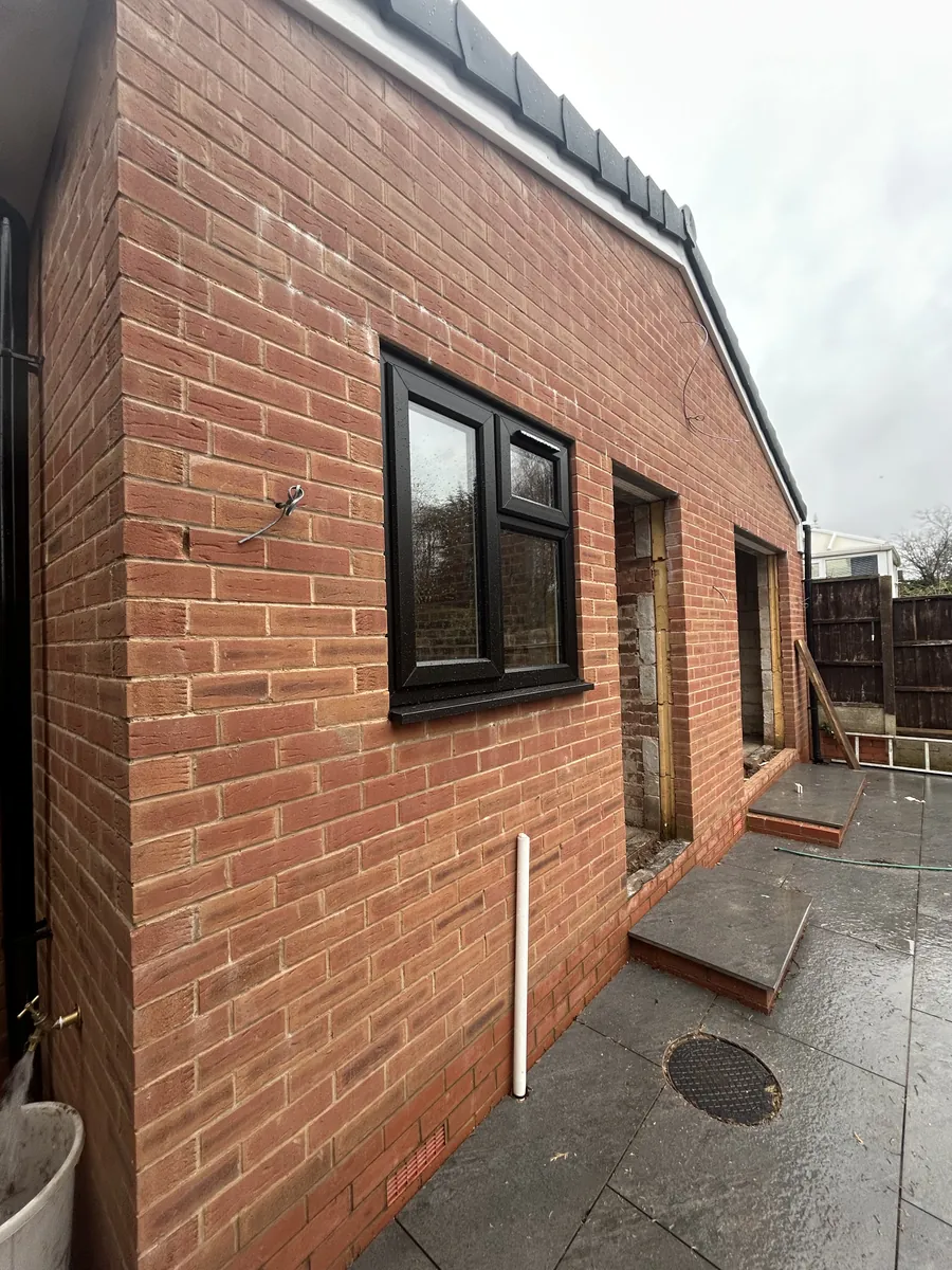 Side elevation of a brick extension with a new window