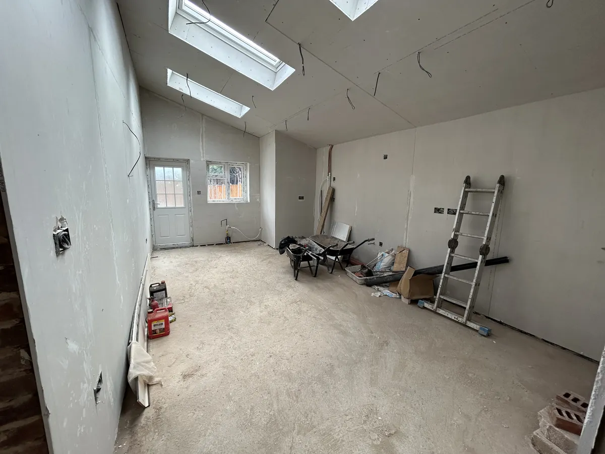 Vaulted extension interior with skylights during fit-out