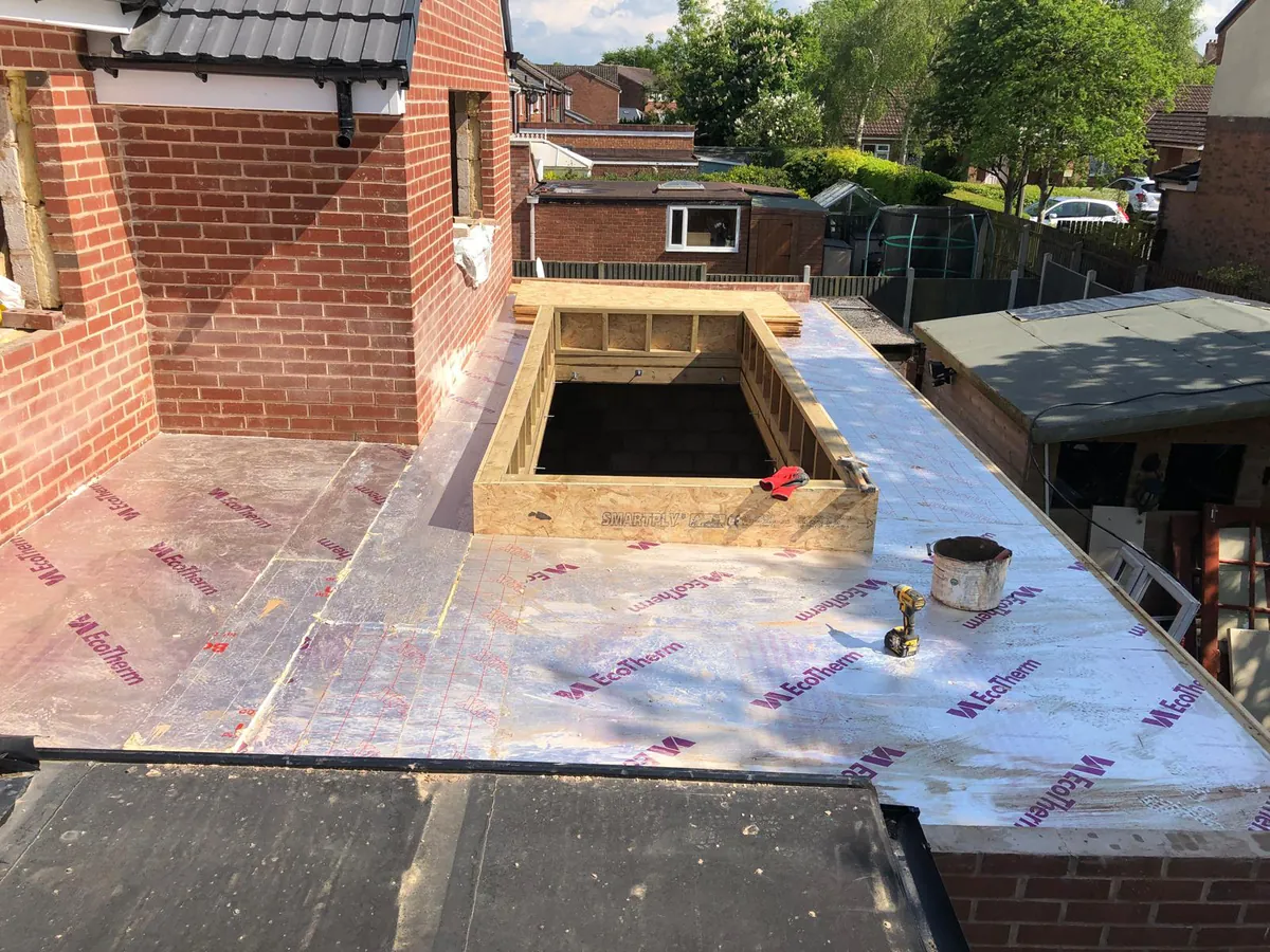 Flat-roof extension under construction with a lantern opening