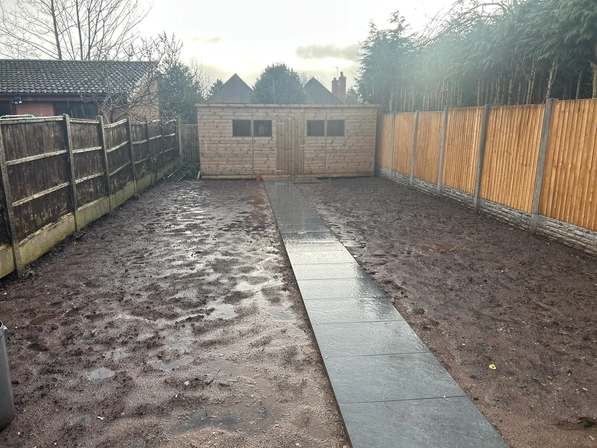 Rear garden groundwork with a newly laid paved path
