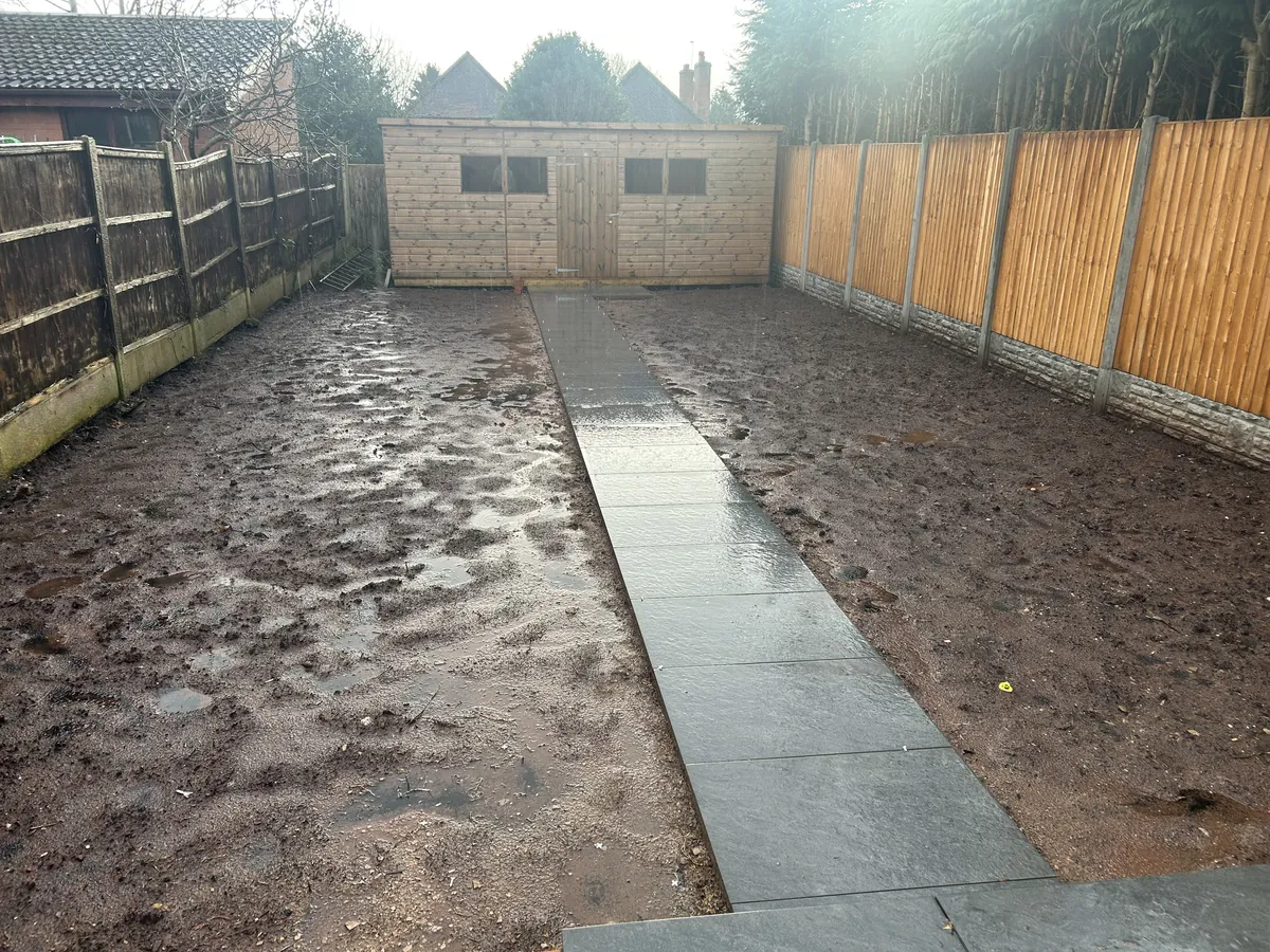 New paved path laid across a rear garden