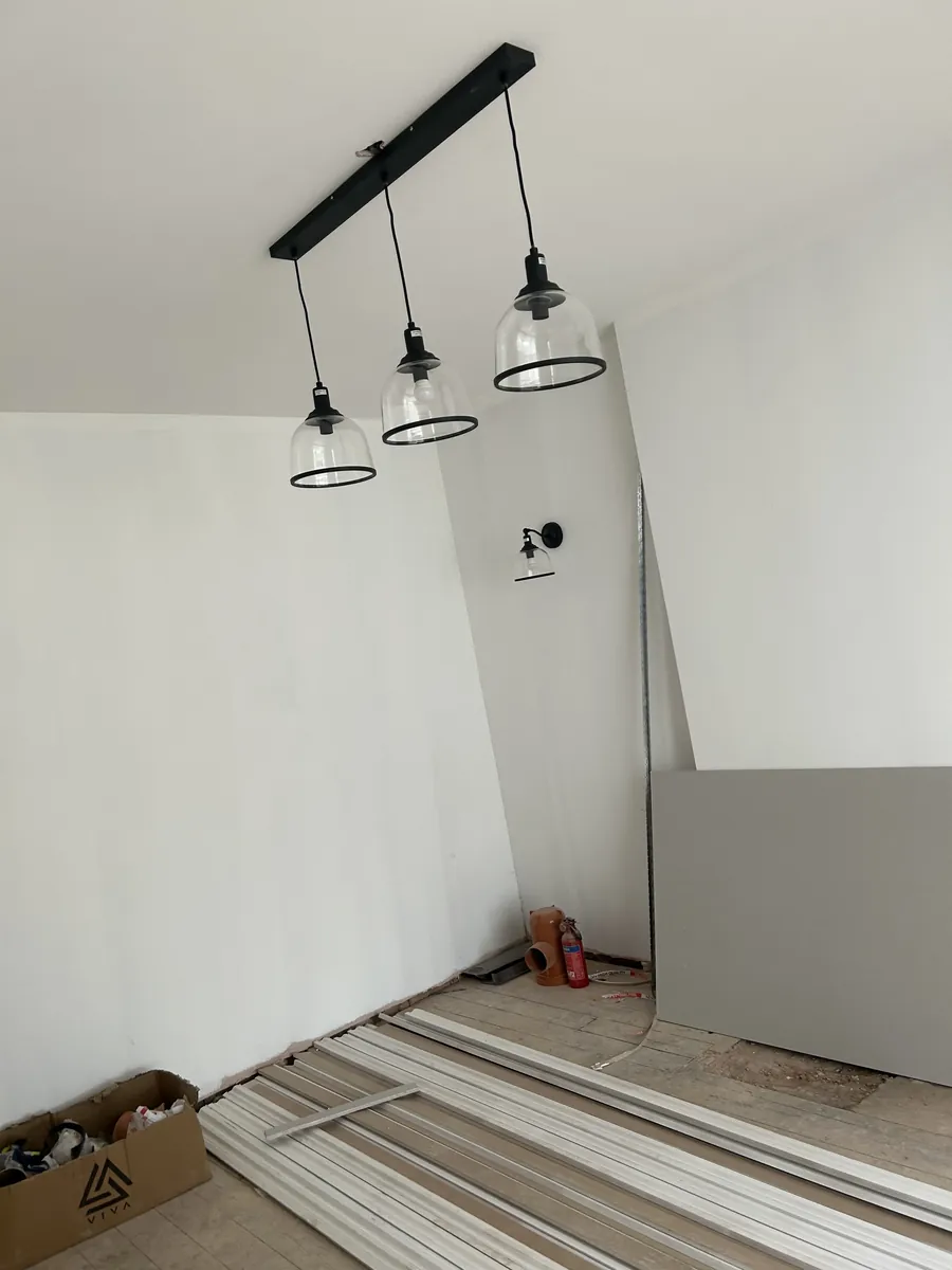 Newly finished room with pendant lighting