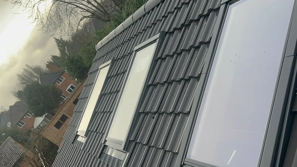 New skylights fitted into a tiled roof for a loft conversion