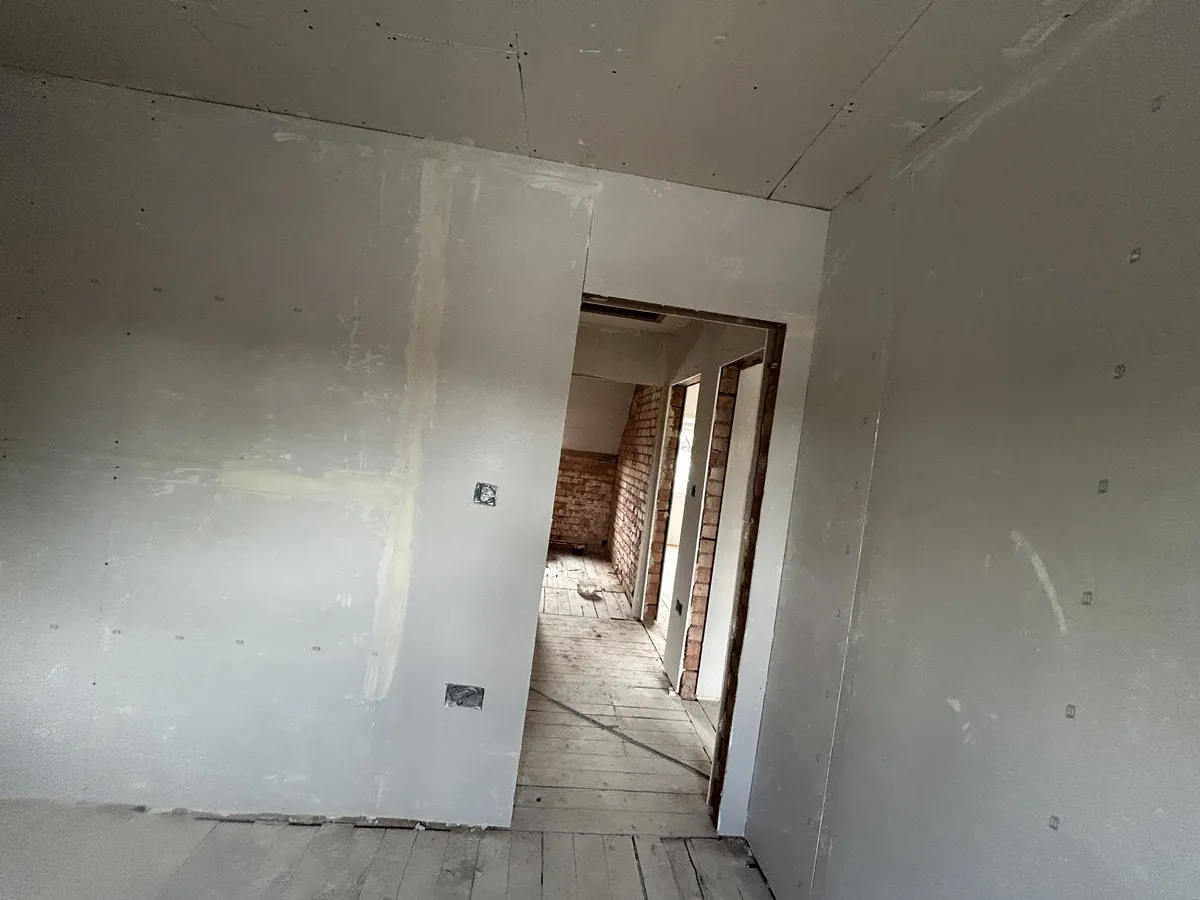 Newly plasterboarded interior walls during a renovation