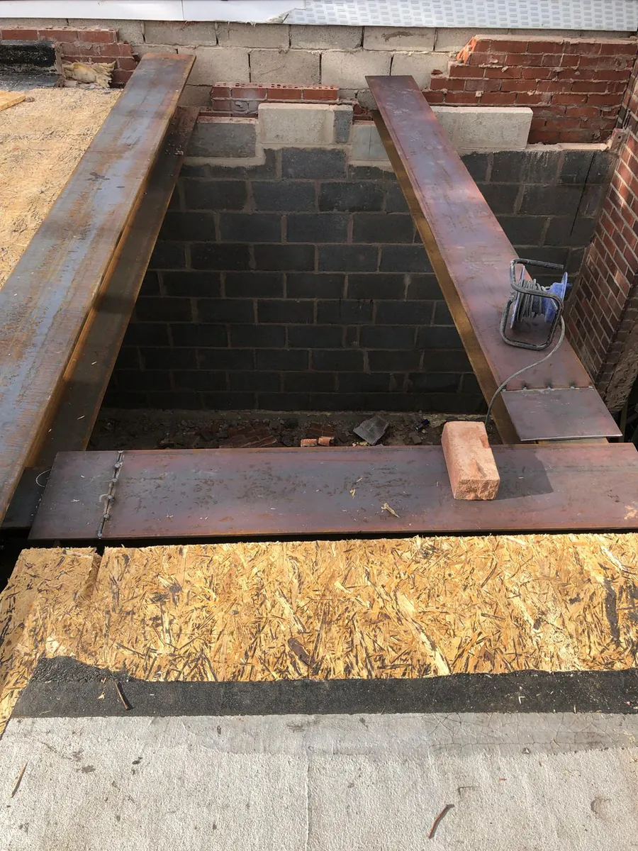 Steel beams installed to form a new structural opening