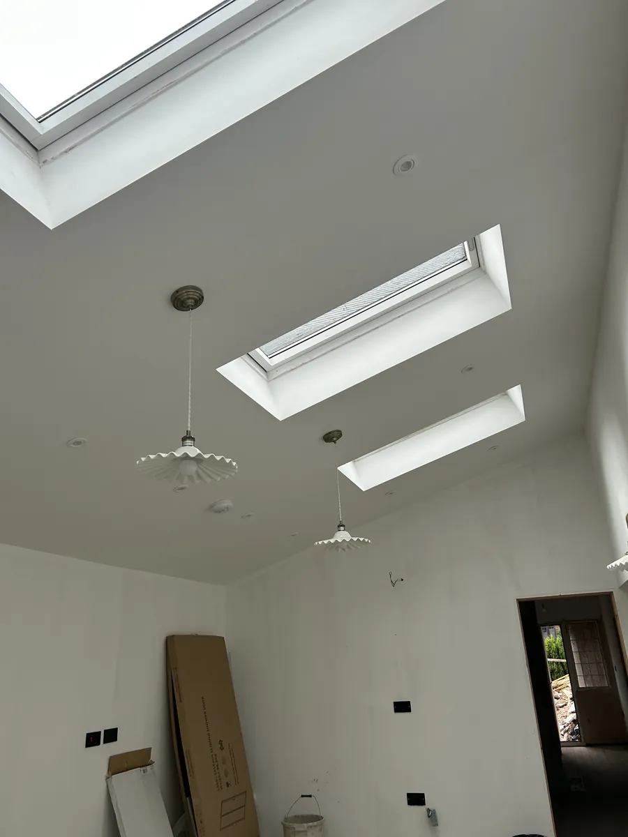 Vaulted ceiling with skylights and pendant lights